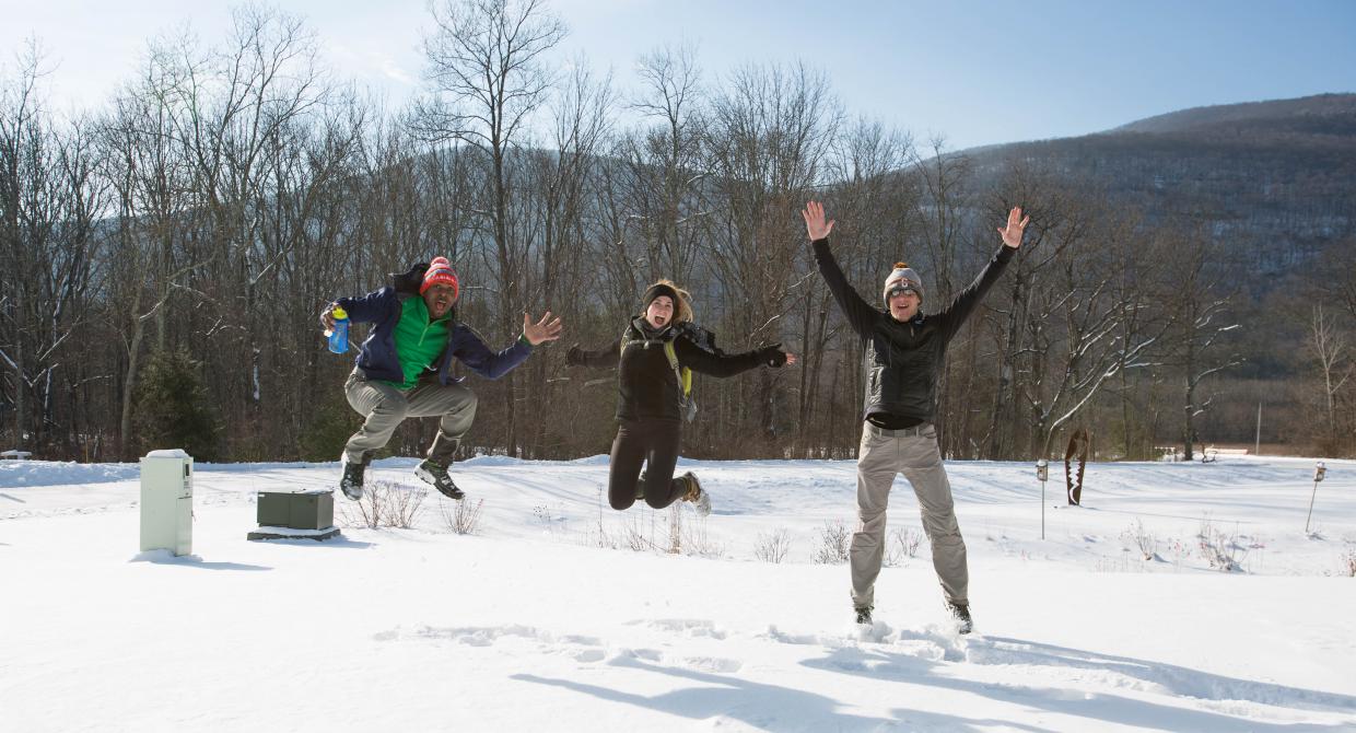 Winter hikers jumping for joy! Photo by Heather Phelps-Lipton.